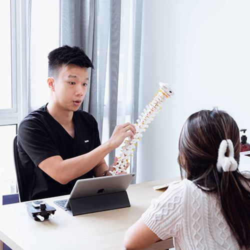 Chiropractor discussing a patient’s health