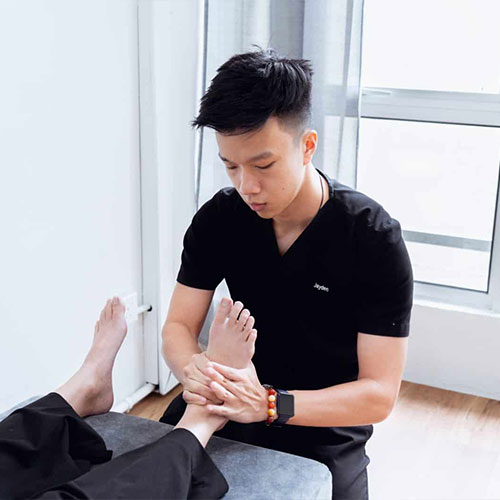 Chiropractor performing an initial treatment